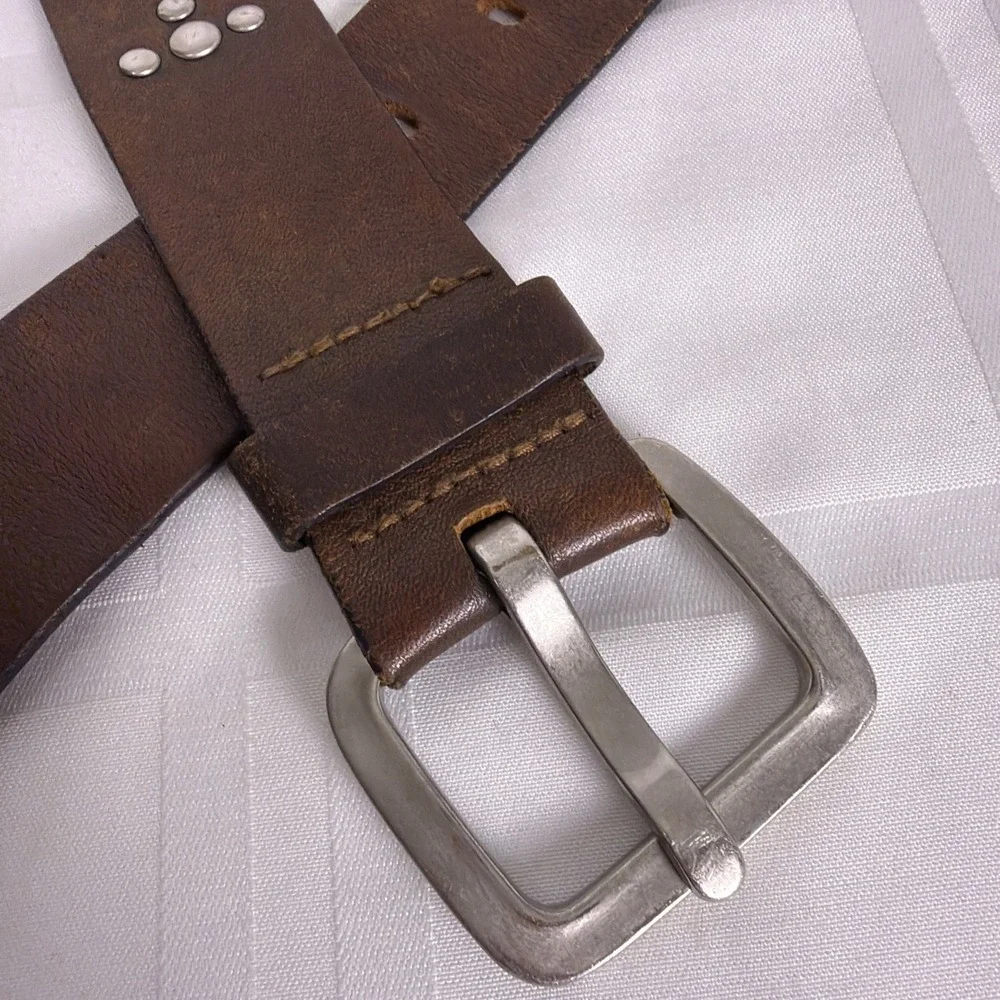 Dark Brown Leather belt with silver buckle and accents. Size XL